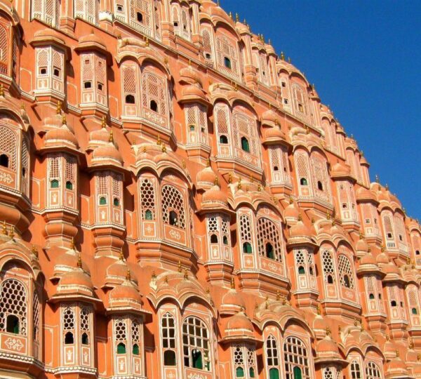 Hawa Mahal, Jaipur’s iconic “Palace of Winds,” is a top tourist attraction. Its unique honeycomb design with 953 windows offers stunning views and cool breezes. Visitors admire its Rajput architecture, rich history, and vibrant surroundings in the heart of Pink City.